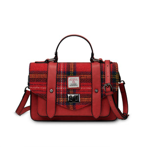 Red plaid handbag with leather straps on a white background