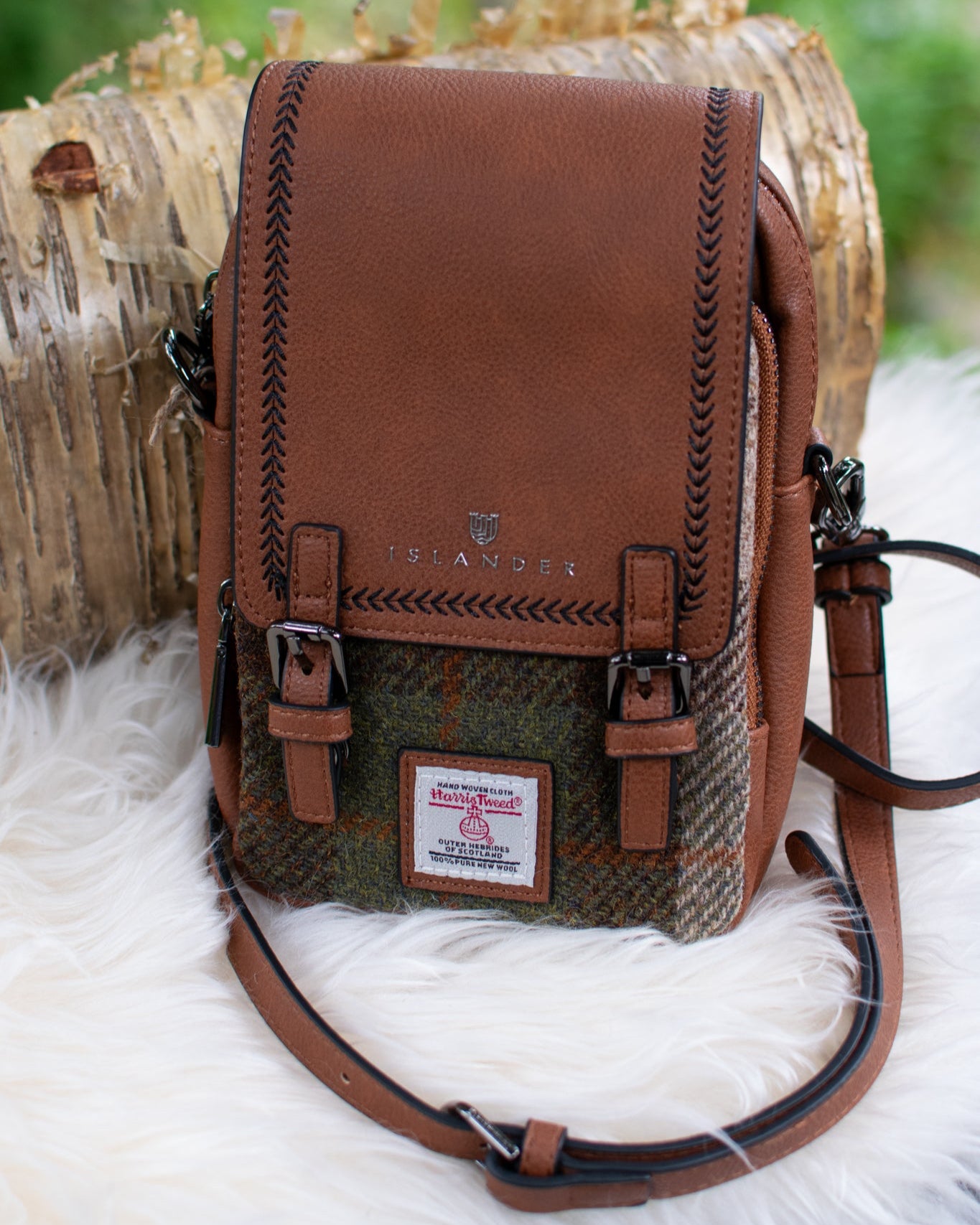 Brown PU leather and tweed pattern bag with a visible brand logo on a white surface.