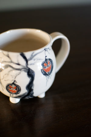 The Haunted Pumpkin Tree Pottery Mug