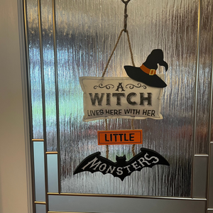 A Witch Lives Here Hanging Sign